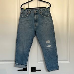 LEVIs Button fly Cropped W31 L26. Distresses. Stiff jeans Gently used. As is.